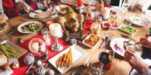 FestiveHolidayDinnerWithRoastTurkeyVegetablesAndWineA | Aaria Rheumatology Gout and Festive Feasting: Enjoy the Holidays Without a Flare-Up