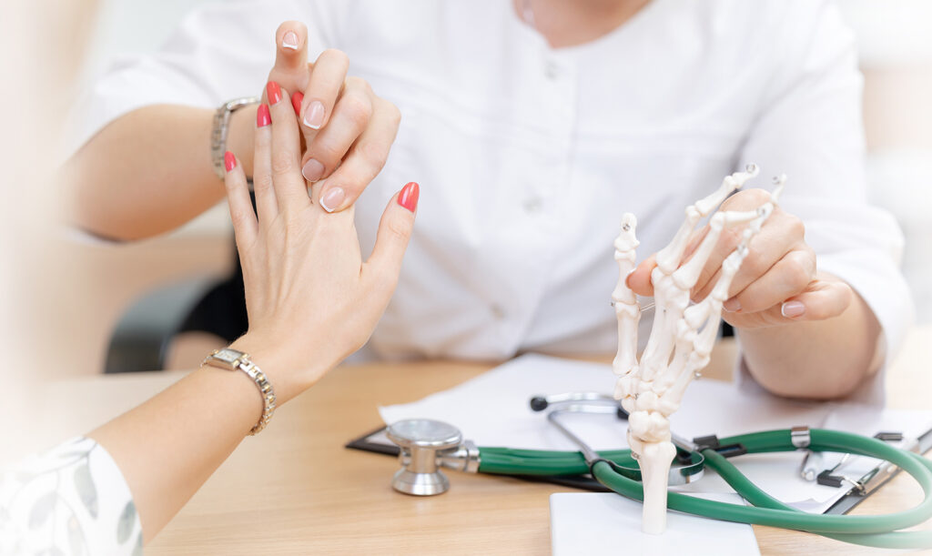 Patient consulting a rheumatologist for joint pain