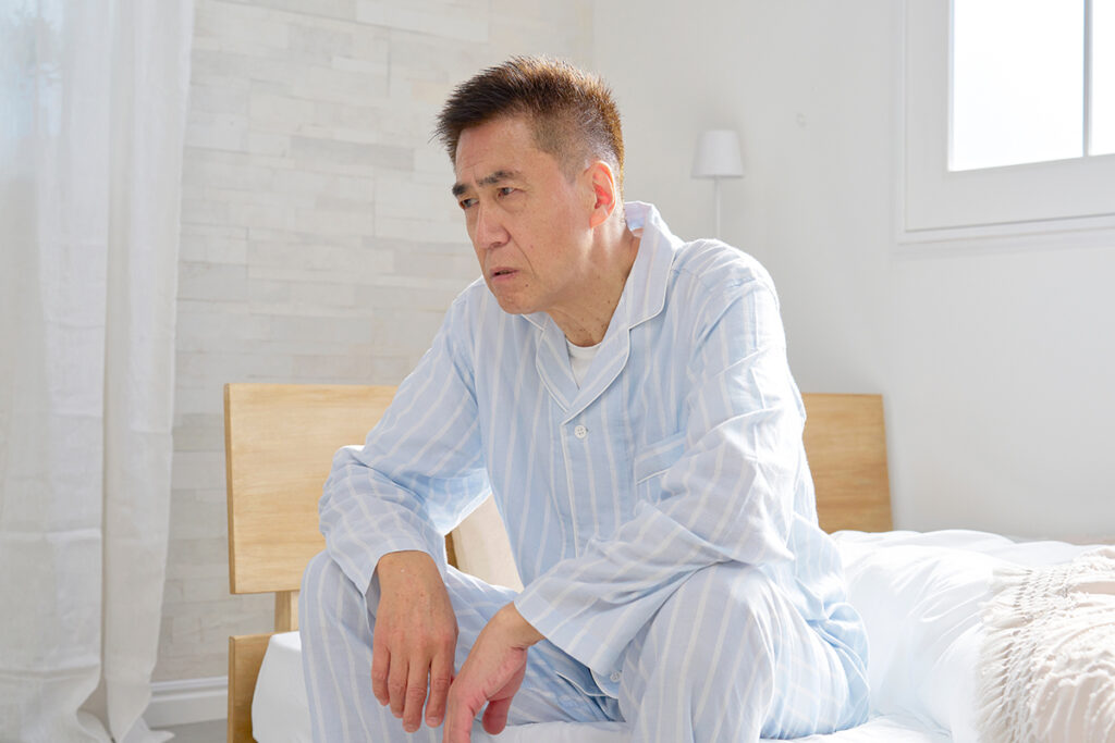 An elderly man experiencing fatigue from rheumatoid arthritis