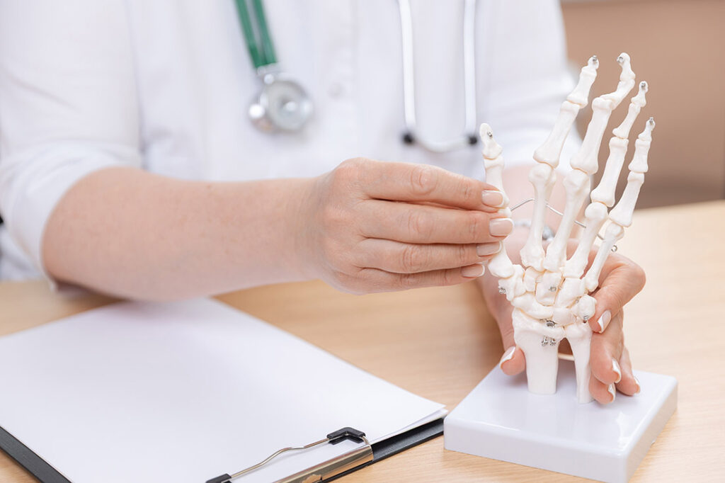 A rheumatology doctor adjusting a display at his table