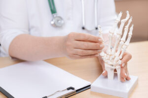 A rheumatology doctor adjusting a display at his table