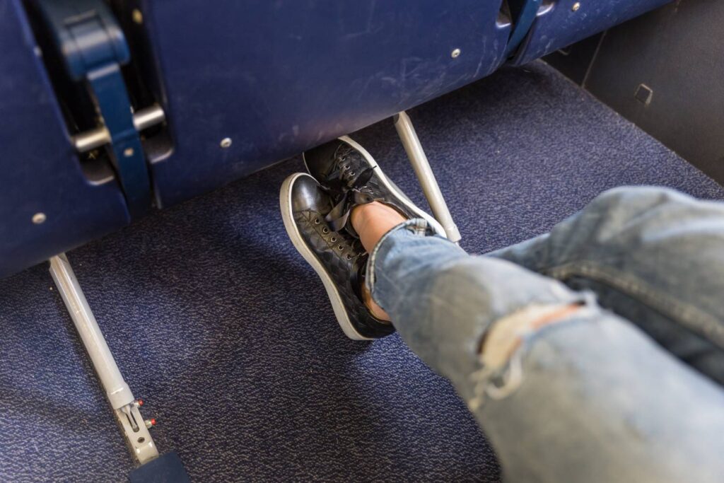 A woman stretching while travelling