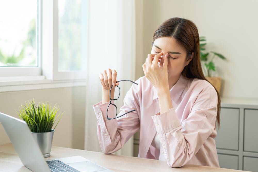 Woman with eye discomfort.