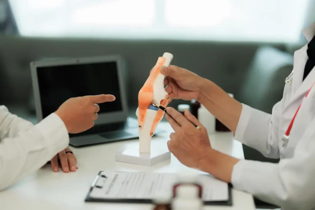 Rheumatologist discussing joint injection treatment options with a patient