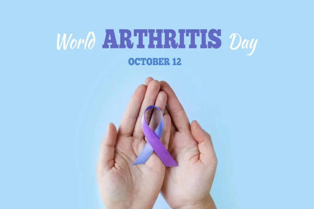 Hands holding a purple ribbon under text that says “World Arthritis Day October 12”