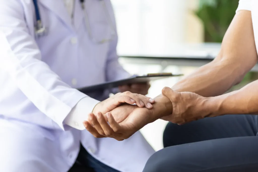 Doctor assessing a patient’s wrist