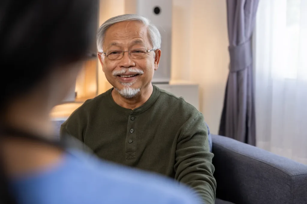 Elderly man smiling at a doctor’s office